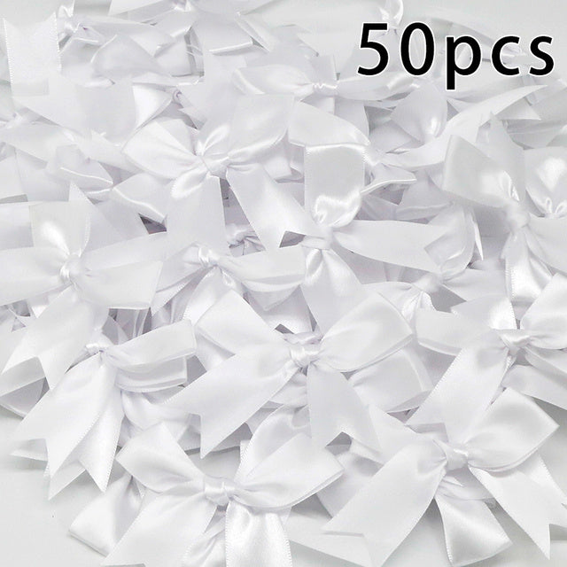 Pacchetti regalo con fiocchi in nastro di raso