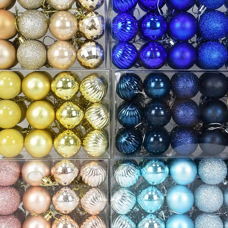 Palline di Natale decorative in plastica color rosa, oro e colori assortiti, confezionate in scatola.