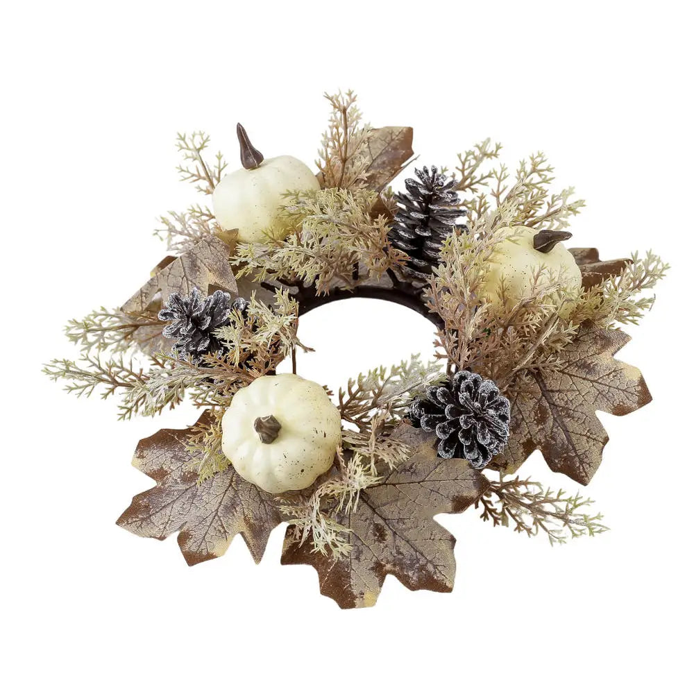 Corona navideña con calabaza, bayas, piñas y arce para decoración del hogar.