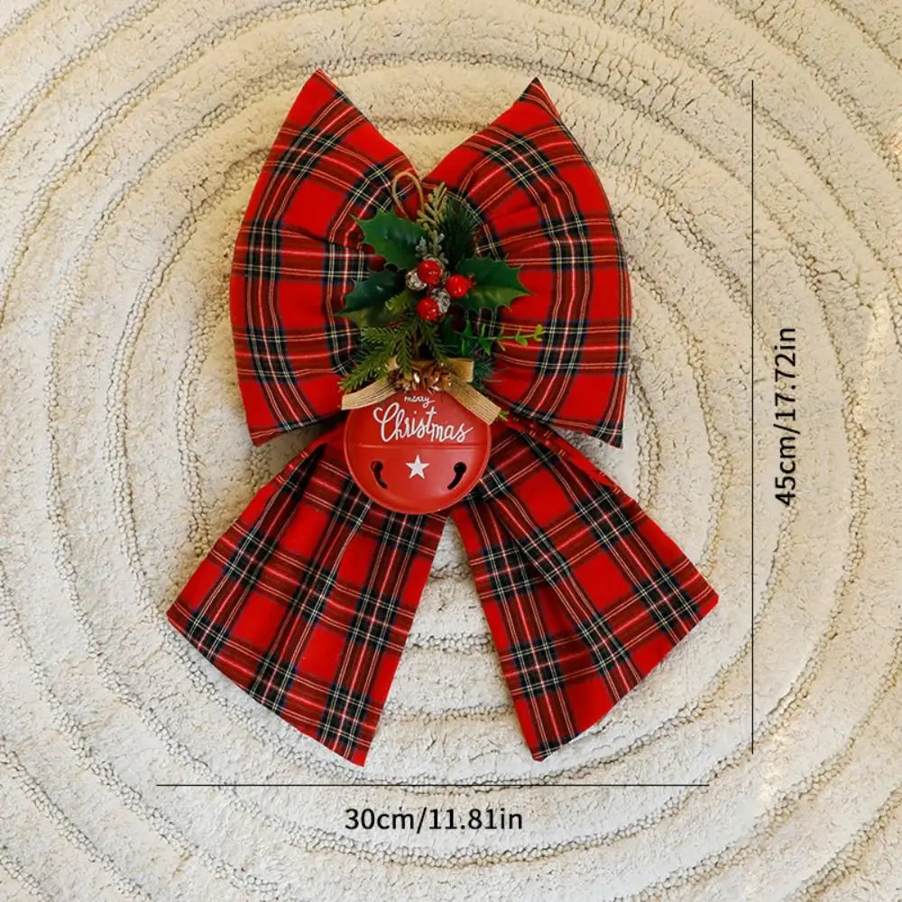 Decorazione natalizia con fiocchi rossi di grandi dimensioni per la punta dell'albero.