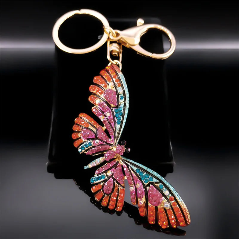 Bunter Schlüsselanhänger mit Strasssteinen und Schmetterlingen in Goldfarbe
