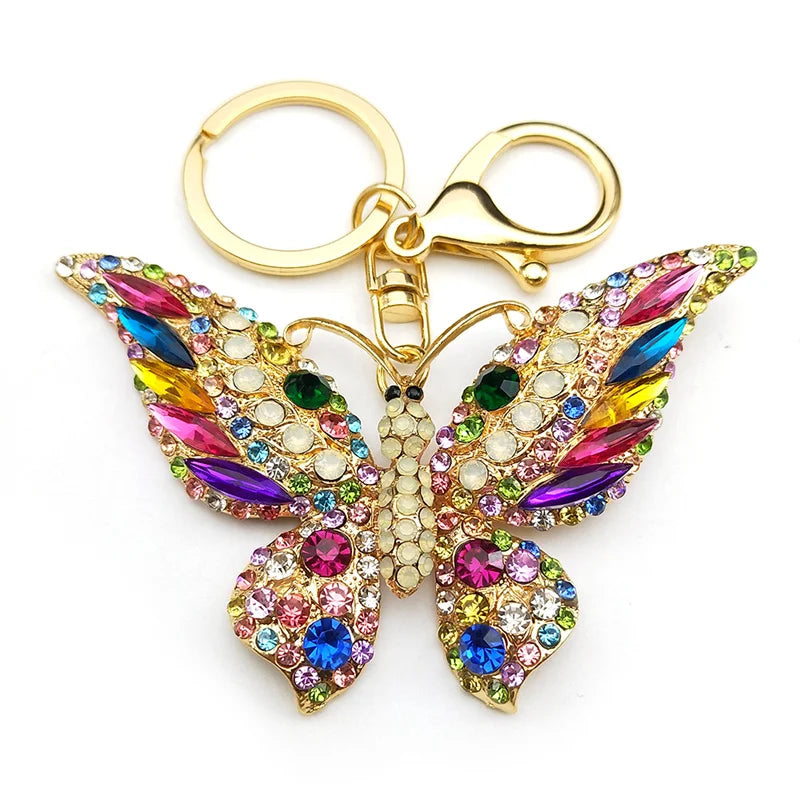 Bunter Schlüsselanhänger mit Strasssteinen und Schmetterlingen in Goldfarbe