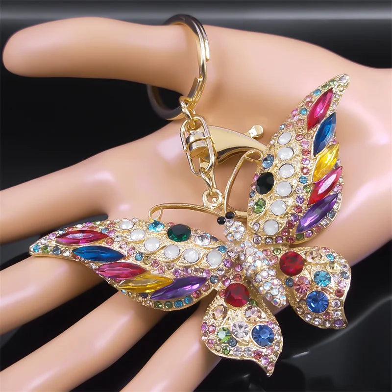 Bunter Schlüsselanhänger mit Strasssteinen und Schmetterlingen in Goldfarbe