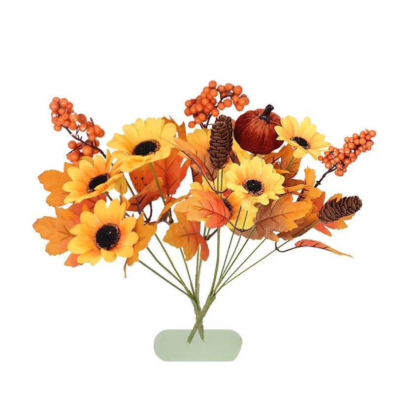 Weihnachtlicher Orangenstrauß mit künstlichen Sonnenblumen und Ahornblättern