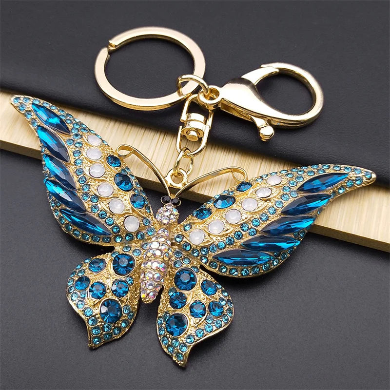 Bunter Schlüsselanhänger mit Strasssteinen und Schmetterlingen in Goldfarbe